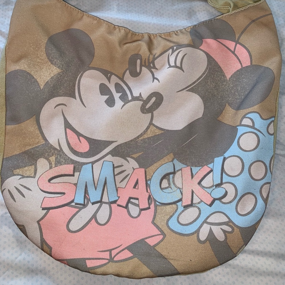 Mickey and Minnie “smooch” over the shoulder bag